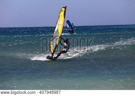 Prasonissi, Rhodes / Greece - June 23, 2014: Surfer At Cape Of Akra Prasonisi, Rhodes, Dodecanese Is