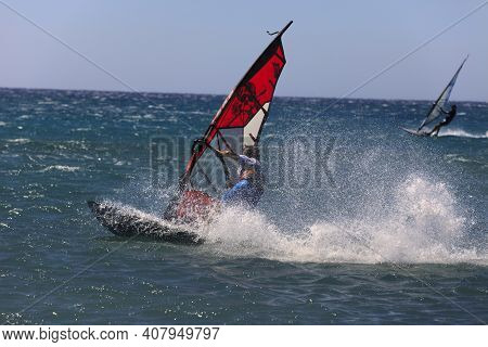 Prasonissi, Rhodes / Greece - June 23, 2014: Surfer At Cape Of Akra Prasonisi, Rhodes, Dodecanese Is
