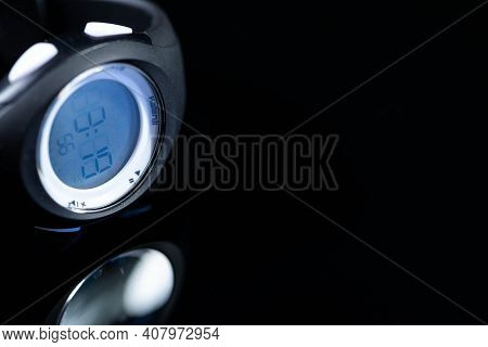 Miercurea Ciuc, Romania- 13 February 2021: Kalenji Sport Watch On Reflecting Dark Surface Close Up S