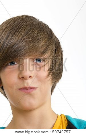 Teen Boy Smirking Into The Camera, Isolated On White