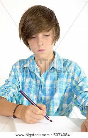 School Boy Working With A Pencil, Isolated On White