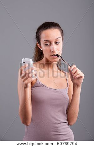 Girl Looking At Her Mobile Phone