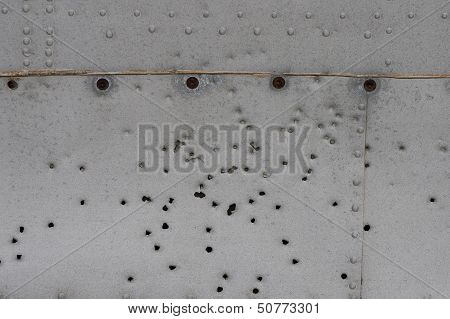 Damaged Metallic Background Texture With Holes