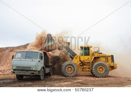 Loading Truck With An Excavator
