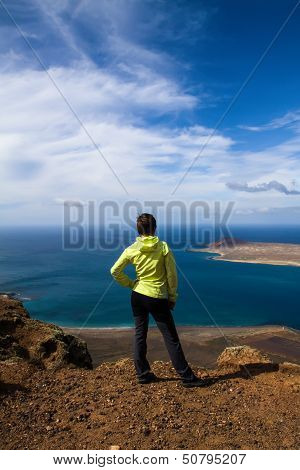 tourist woman on the top of rock