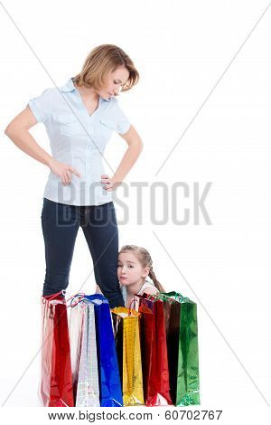 Mother And Young Daughter With Shopping Bags