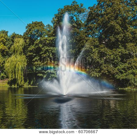 Fountain  And Rainbow In Riga Canal, That Flows Through Bastion Park (bastejkalns). Latvia