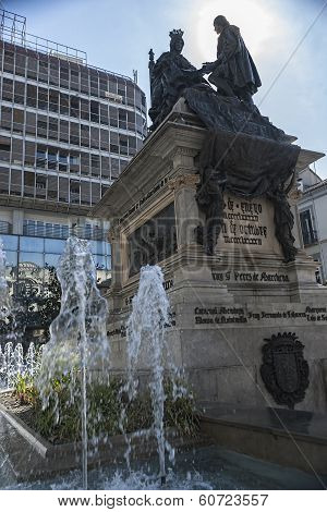 Monument To Isabel La Católica And Cristobal Colon Against Bank Building