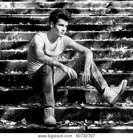 Attractive Young Handsome Man, Model Of Fashion In Stairs