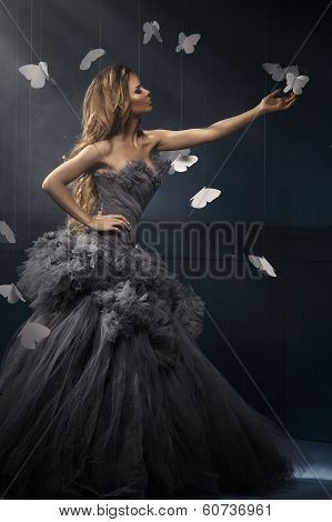 Beauty Blonde Woman On The Fog With Butterflies