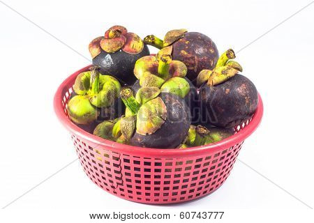 Mangosteen In Red Basket  Isolated On White