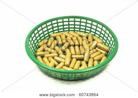 Medicine capsule in a basket isolated