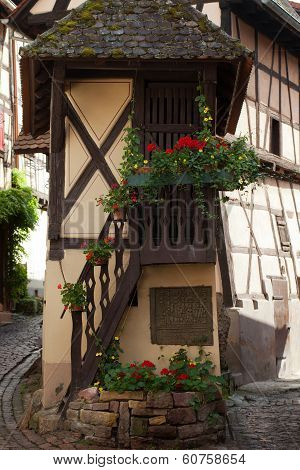 Street with half-timbered medieval houses in Eguisheim