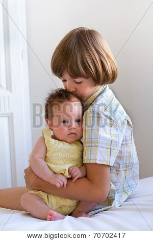 Brother Kissing His Baby Sister
