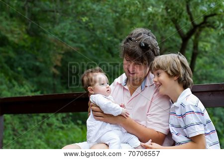 Father With Son And Newborn Daughter