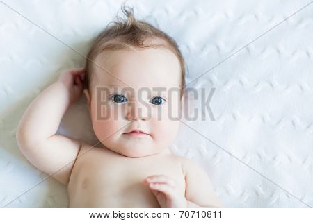 Adorable Blue Eyed Baby On A White Knit Blanket