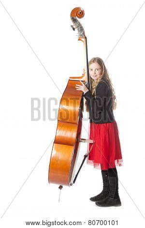 Young Girl Leans Against Double Bass In Studio