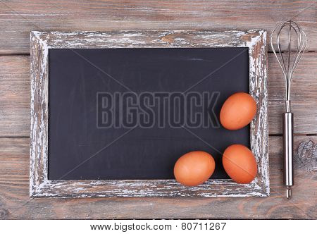 Blackboard blank on rustic wooden planks background