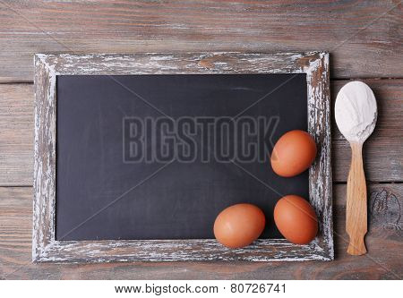 Blackboard blank on rustic wooden planks background
