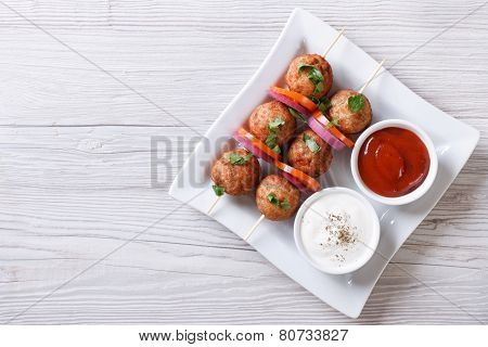 Meatballs On Skewers And Sauces Horizontal Top View