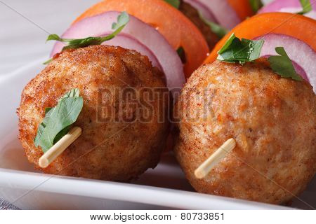 Fried Meatballs On Skewers With Vegetables Macro. Horizontal