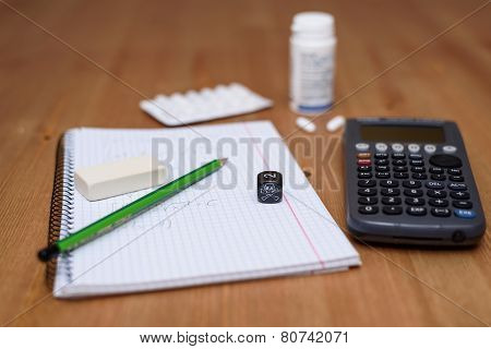 Study Place With Calculator And Painkillers In Background