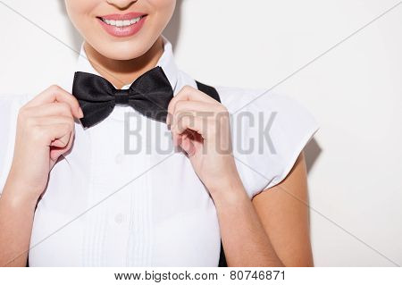 Adjusting Her Bow Tie.
