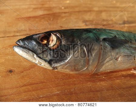 Smoked mackerel on wooden table.