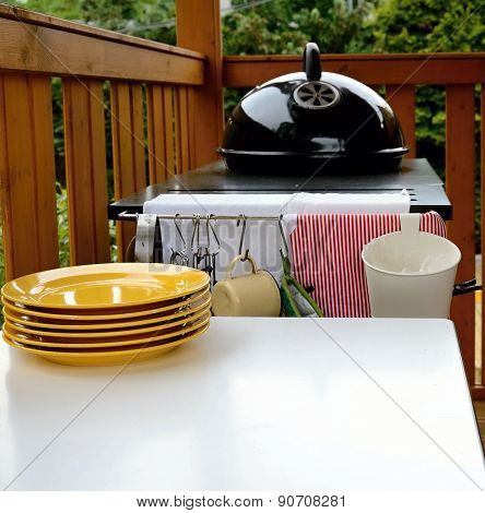 Garden grill with plate and table