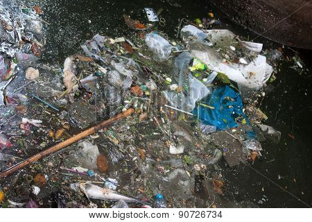 Garbage Piling Up At A Flooded Street During The Monsoon Season In Bangkok