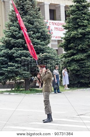 Makeevka, Ukraine - May, 9, 2012: A Supporter Of Communist Ideology With A Red Flag