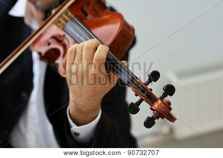 Men Violinist Playing Classical Violin Music in Musical Performance