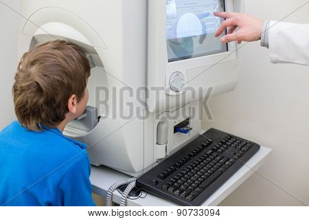 boy instrumental examination by an ophthalmologist