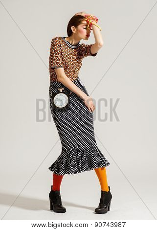 Fashion model pose on light background
