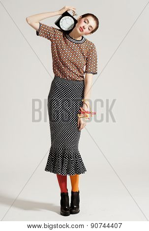 Fashion model pose on light background