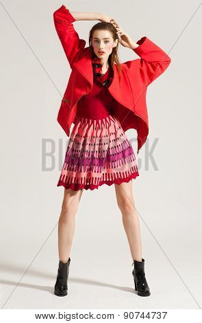 Fashion model pose on light background