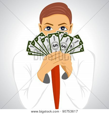 businessman holding fan of money