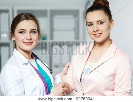 Doctor And Patient Shaking Hands