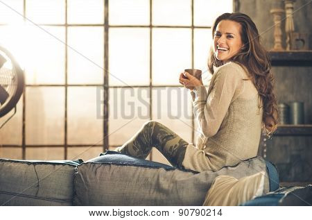 Profile Shot, Woman Smiling Looking Over Shoulder Holding Cup