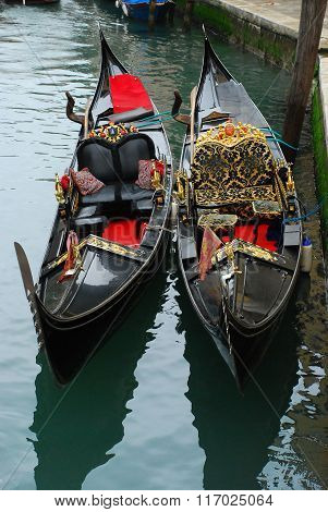 boats gondolas on canal in venice