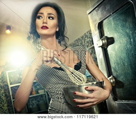 Beautiful brunette mixing ingredients in a bowl. Sensual slim young woman with black bra
