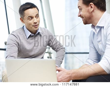 Business Persons Chatting Gossiping In Office