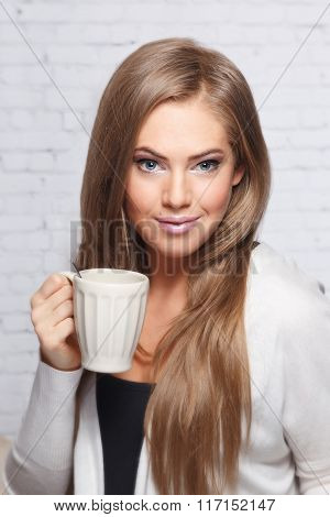 Beautiful Woman Holding A Cup Of Drink