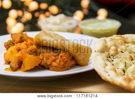 Aloo chaat with naan bread