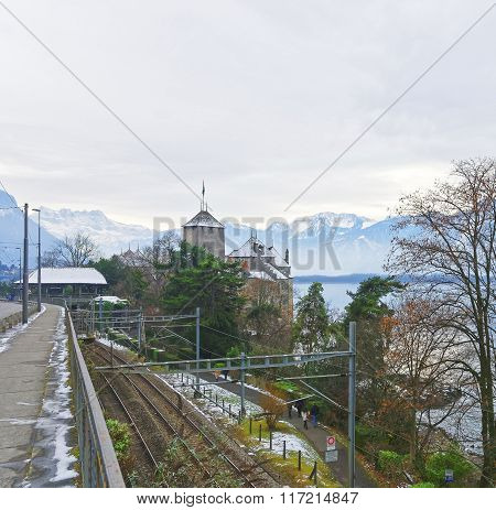 VEYTAUX SWITZERLAND - JANUARY 2 2015: View to the Chillon Castle from a bridge. It is an island castle on Lake Geneva (Lac Leman) in the Vaud between Montreux and Villeneuve.