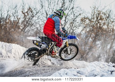 racer on a motorcycle jump on hill