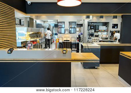 LA VILLE-AUX-DAMES, FRANCE - AUGUST 12, 2015: McDonald's restaurant interior. McDonald's is the world's largest chain of hamburger fast food restaurants, founded in the United States.