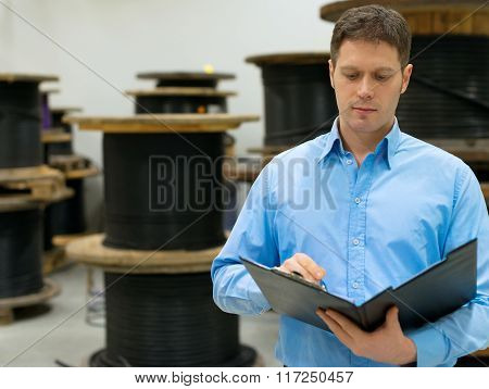 Handsome manager at electrical wire and cable factory.