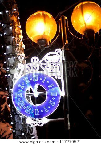 Glowing Clock On The Lantern
