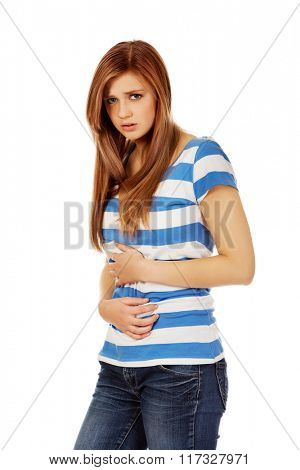 Teenage woman with stomach ache 